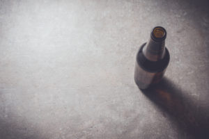 Beer bottle on dark table