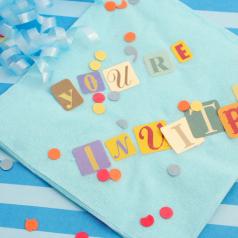 Cut-out letters on light blue napkin read "You